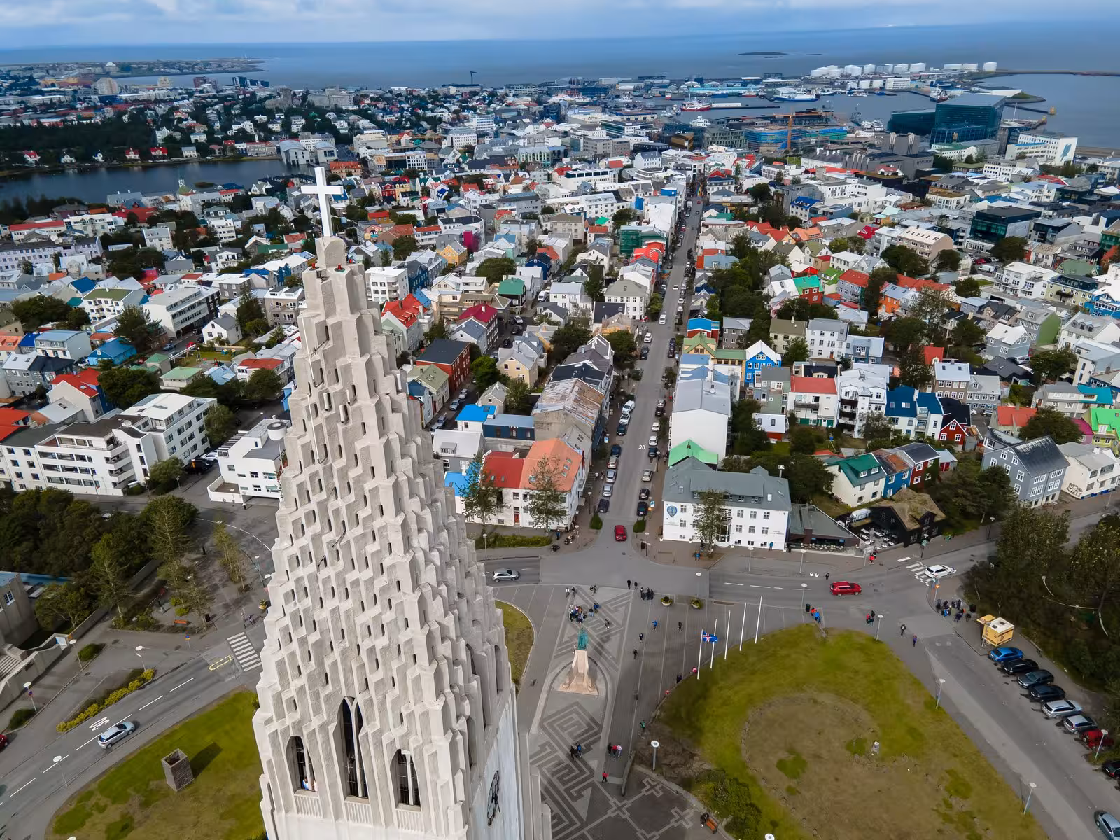 Aerial view of Reykjavik cityscape with iconic Hallgrímskirkja church tower, highlighting Icelandic architecture.
