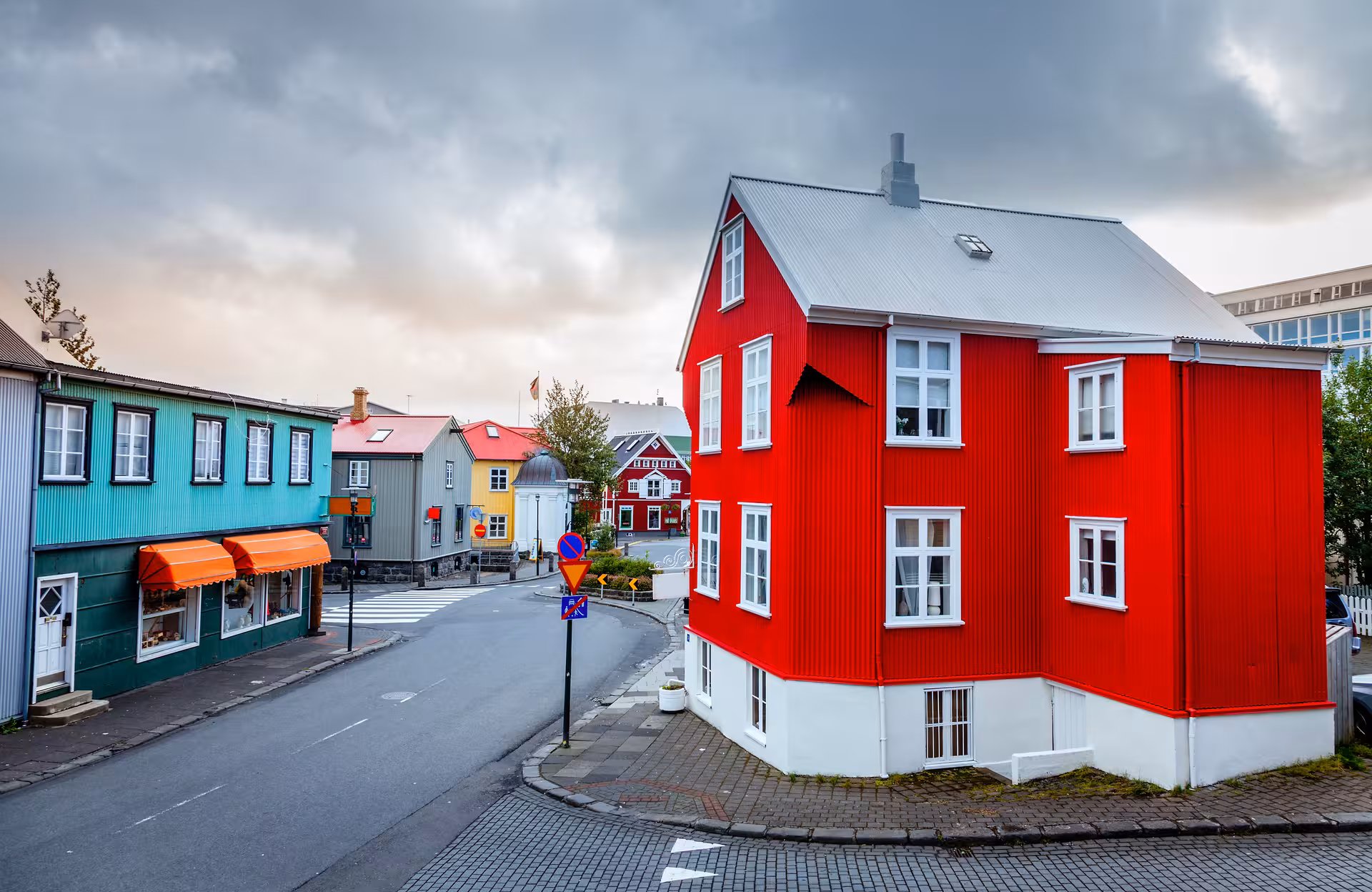Colorful Reykjavik street with iconic red house, a scenic stop on a 7-day small group Iceland tour