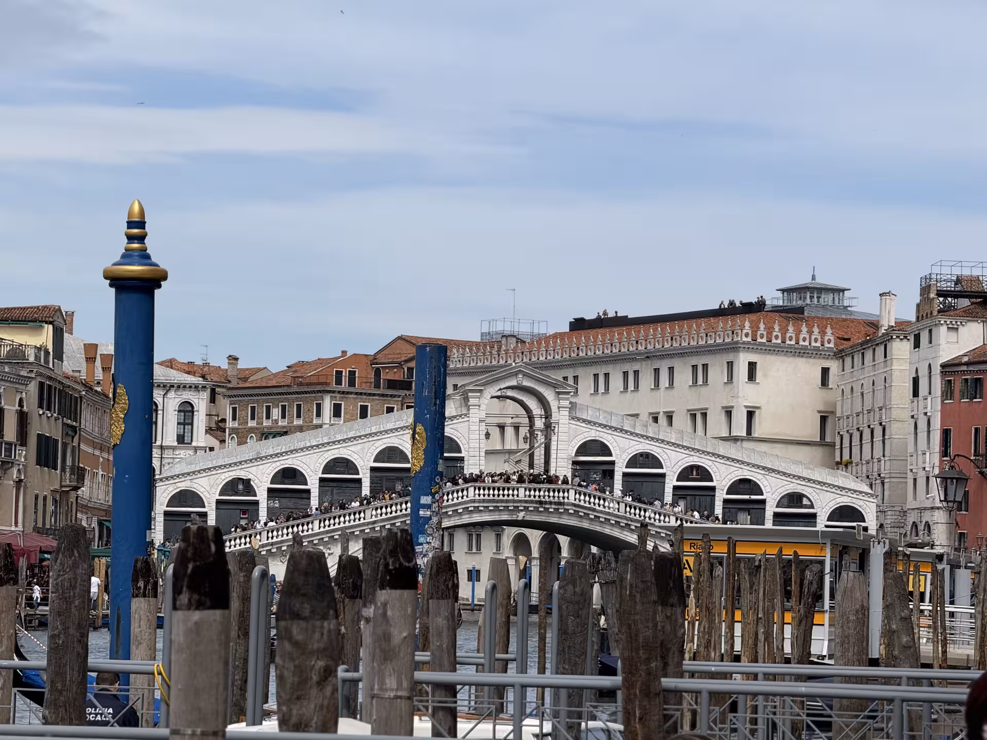 View of the iconic Rialto Bridge over the Grand Canal, a highlight on the San Marco to Rialto Walk tour in Venice.