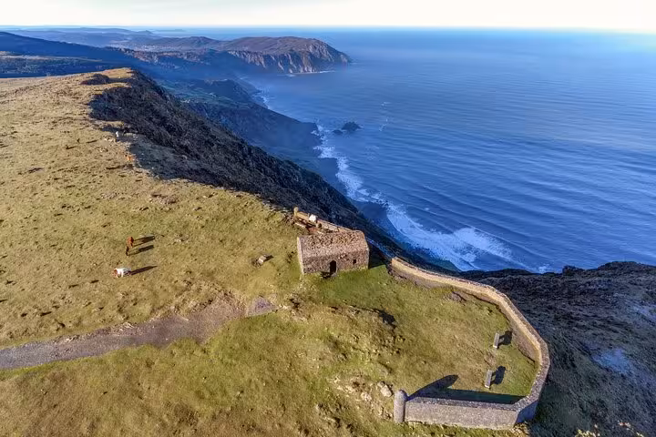 Aerial view of the dramatic cliffs and Atlantic Ocean along the Rías Altas coastline in Galicia, Spain.