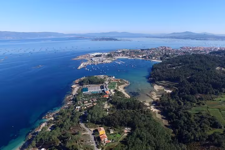 Scenic aerial view of Rias Baixas coastline, highlighting lush landscapes and serene waters for the excursion.