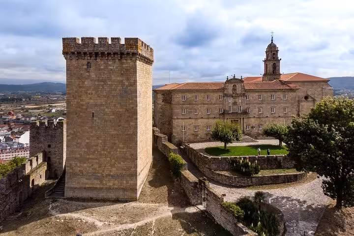 Historic stone architecture of Ribeira Sacra's monastery, showcasing Galicia's cultural heritage on a Santiago tour.