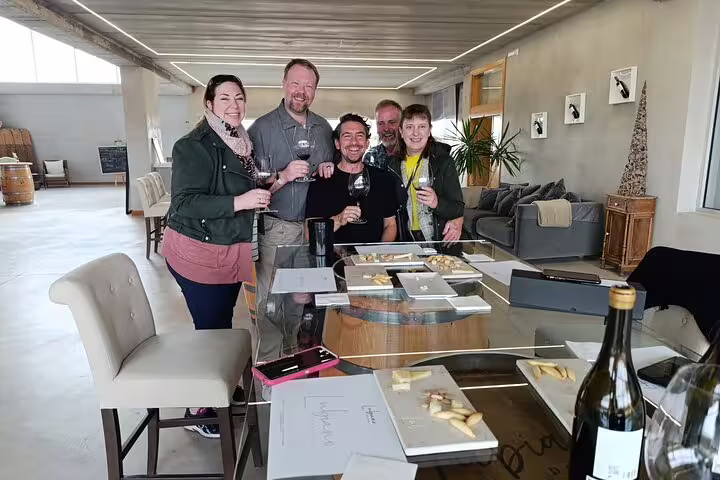 Group enjoying wine tasting at a modern Ribera del Duero winery on a private tour from Madrid.