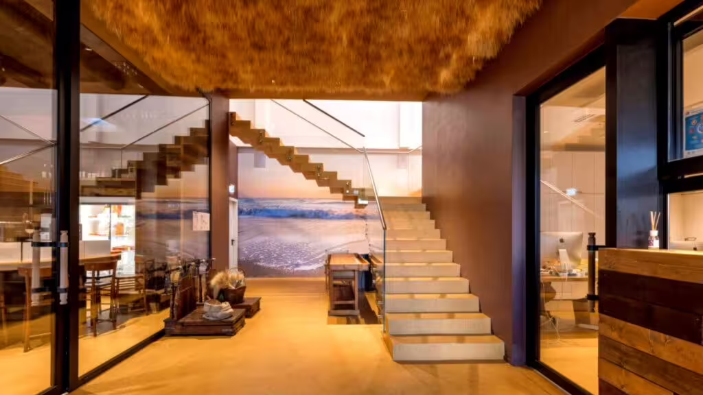 Modern entrance of Rimini Piadina Museum with staircase and dining area for piadina lunch or dinner tour