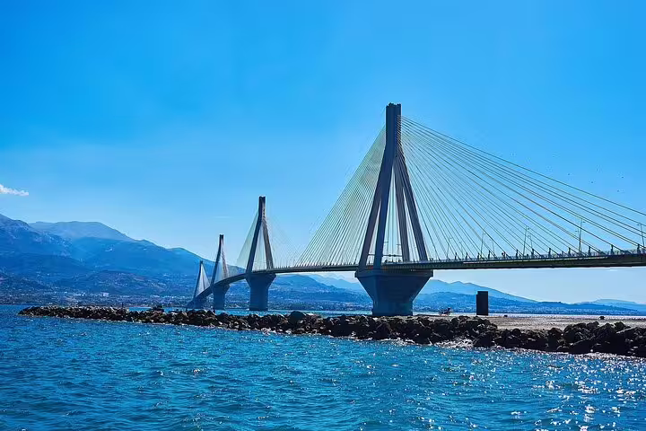 Stunning view of the Rio-Antirrio Bridge spanning over blue waters, a key attraction in the Athens classical tour.