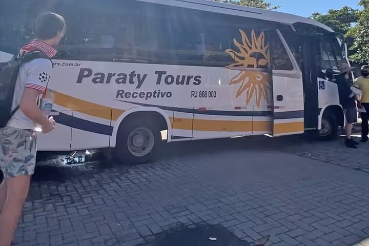 Paraty Tours shuttle bus ready for departure from Rio de Janeiro to Angra dos Reis, showcasing convenient group travel.