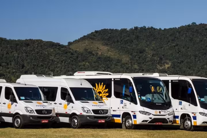 Fleet of Paraty Tours vans and buses ready for shared transfer from Rio de Janeiro to Paraty.