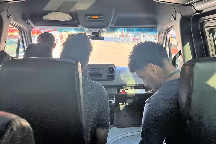 View from inside a shuttle with passengers heading from Rio de Janeiro to Angra dos Reis, showcasing a smooth journey.