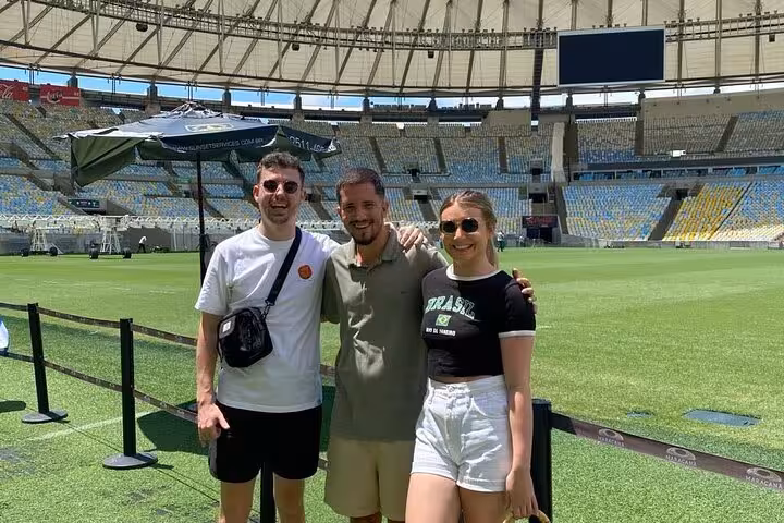 Group photo on the pitch during Rio de Janeiro Maracanã Stadium tour with a local guide