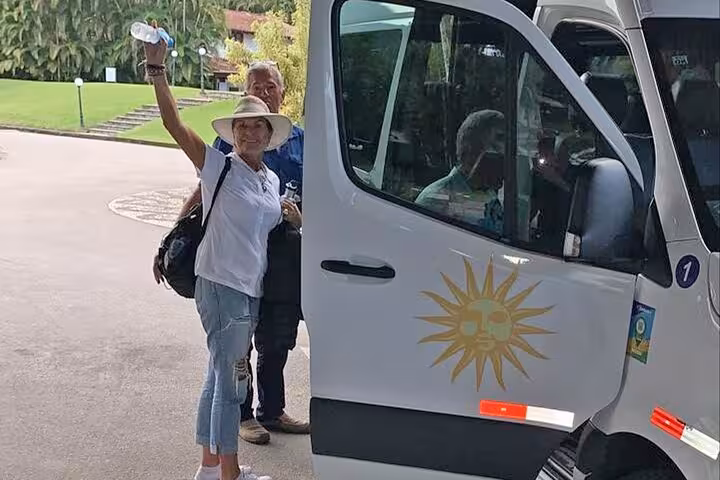 Happy travelers board a comfortable shuttle van for a transfer from Rio de Janeiro to Ilha Grande.