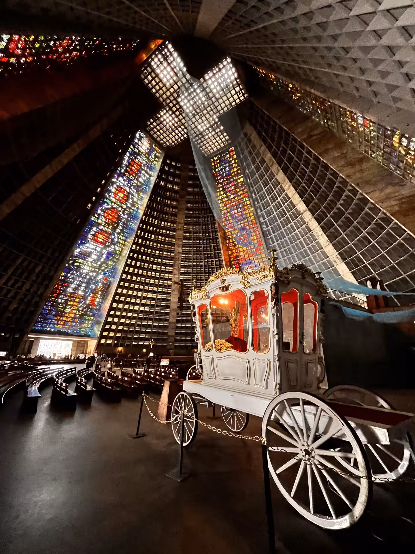 Inside Rio Metropolitan Cathedral, stained glass and ceremonial carriage on historical city centre pedicab tour