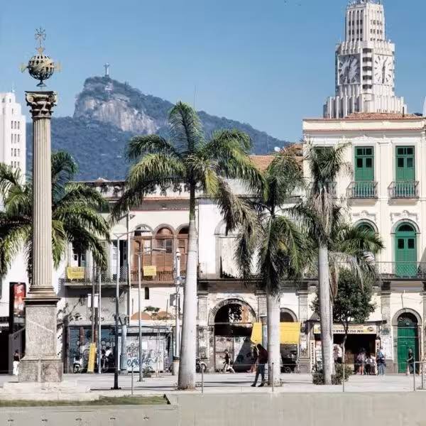 Palm trees in Rio's historic district with Christ the Redeemer in the background, central to the Samba tour experience.