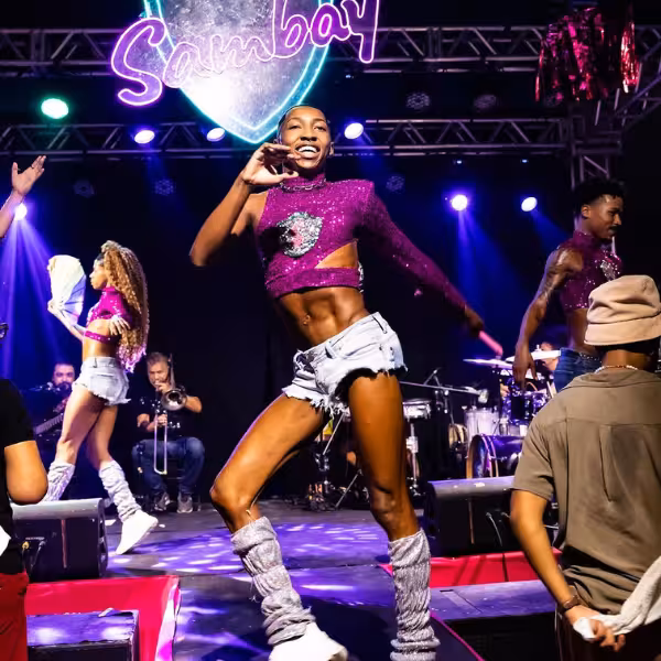 Dynamic samba dancer on stage captivates the audience during a thrilling Rio Gay Nightlife Experience event.
