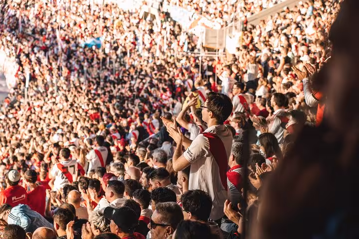 Crowd applauding at River Plate game in El Monumental, Buenos Aires, on guided matchday tour with local fan