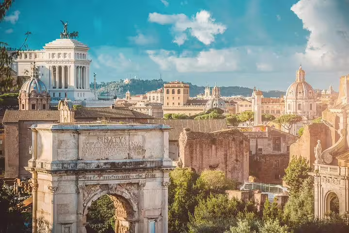 Panoramic view of Roman Forum, Arch of Titus and Vittoriano monument on Best of Rome Colosseum and fountains guided tour