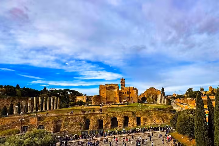 Vibrant scene of the Roman Forum with crowds exploring historic ruins and columns under a colorful sky.