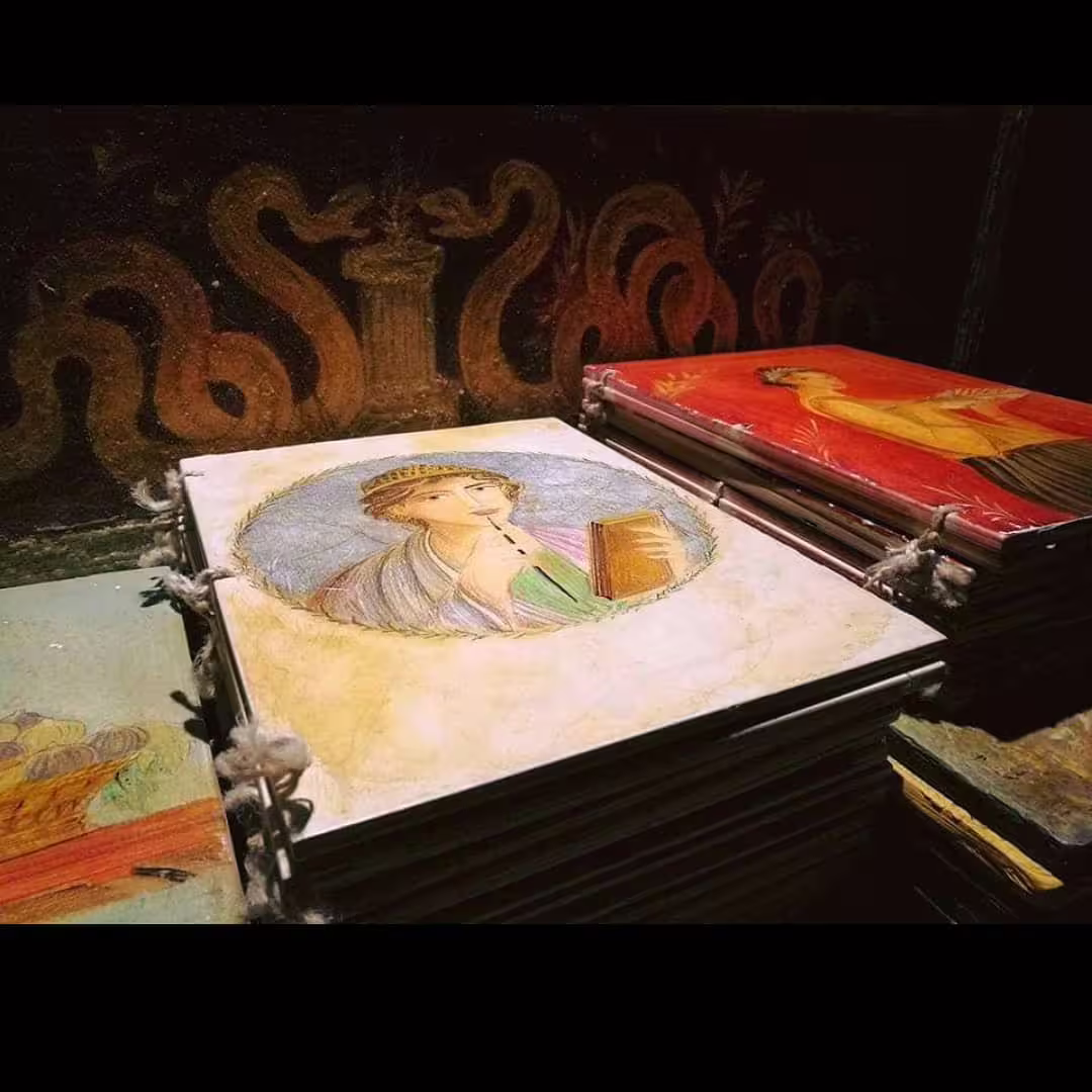 Stack of Roman fresco tiles with painted muse and mythological motifs, evoking ancient Pompeii art on New Year’s Eve tour