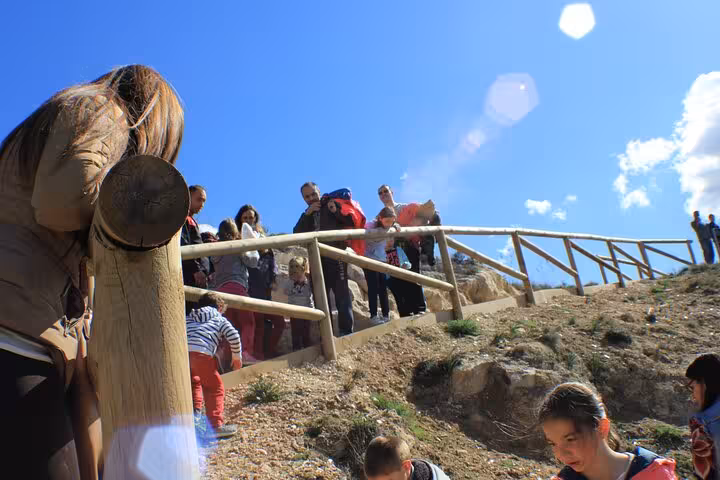 Visitors climb the trail to the Roman Lapis Specularis Mines entrance on a guided tour in Cuenca, Spain