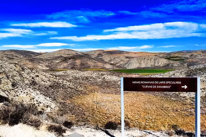 Directional sign to Roman Lapis Specularis Mines, Cuevas de Sanabrio, with scenic Cuenca countryside views
