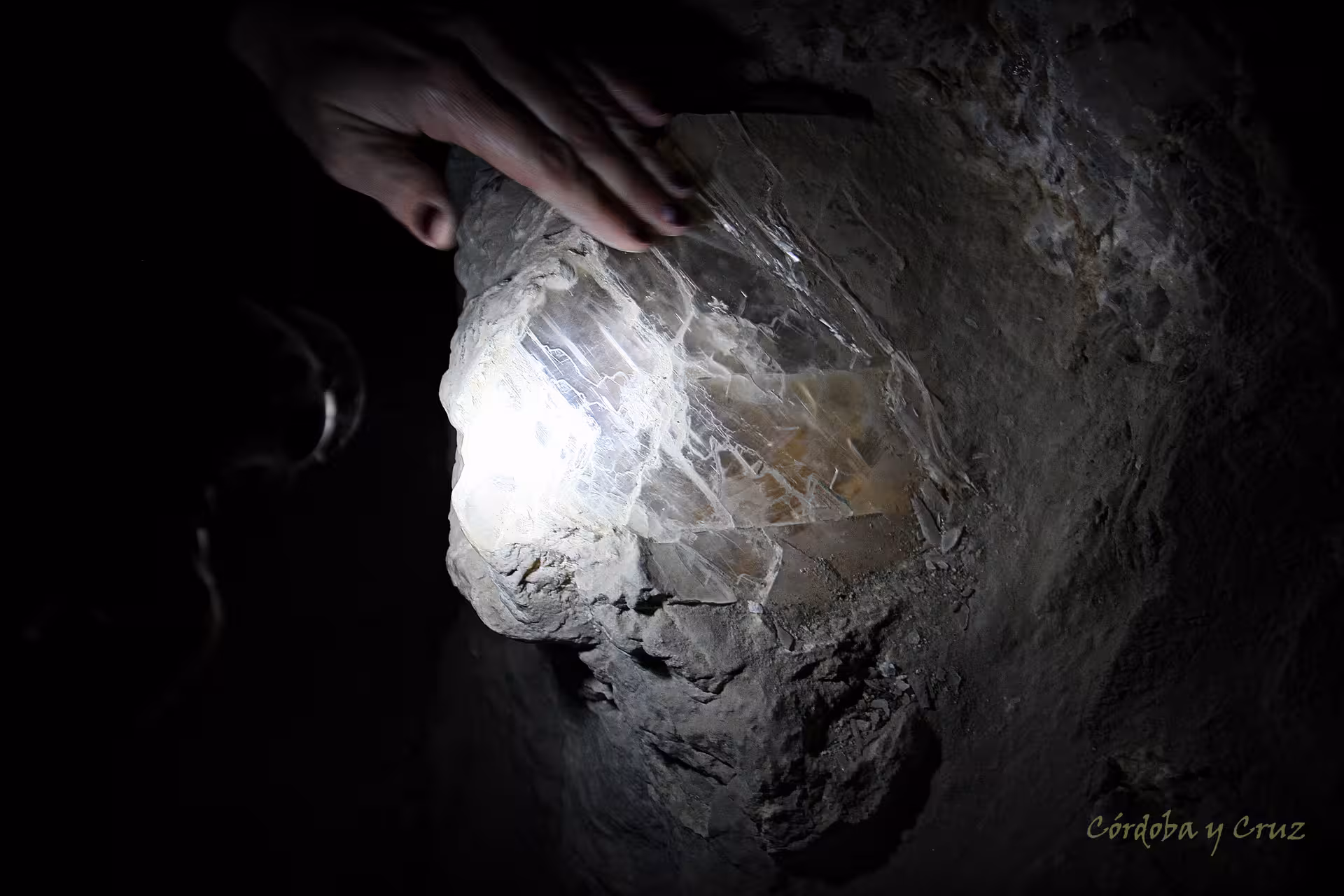 Close-up of crystal vein inside Roman mine, highlight of Roman Empire day trip from Madrid underground tour