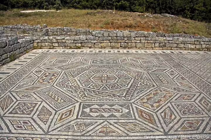 Intricate Roman mosaic floor at Conimbriga, showcasing ancient artistry on a day tour from Lisbon to Fatima and Conimbriga.