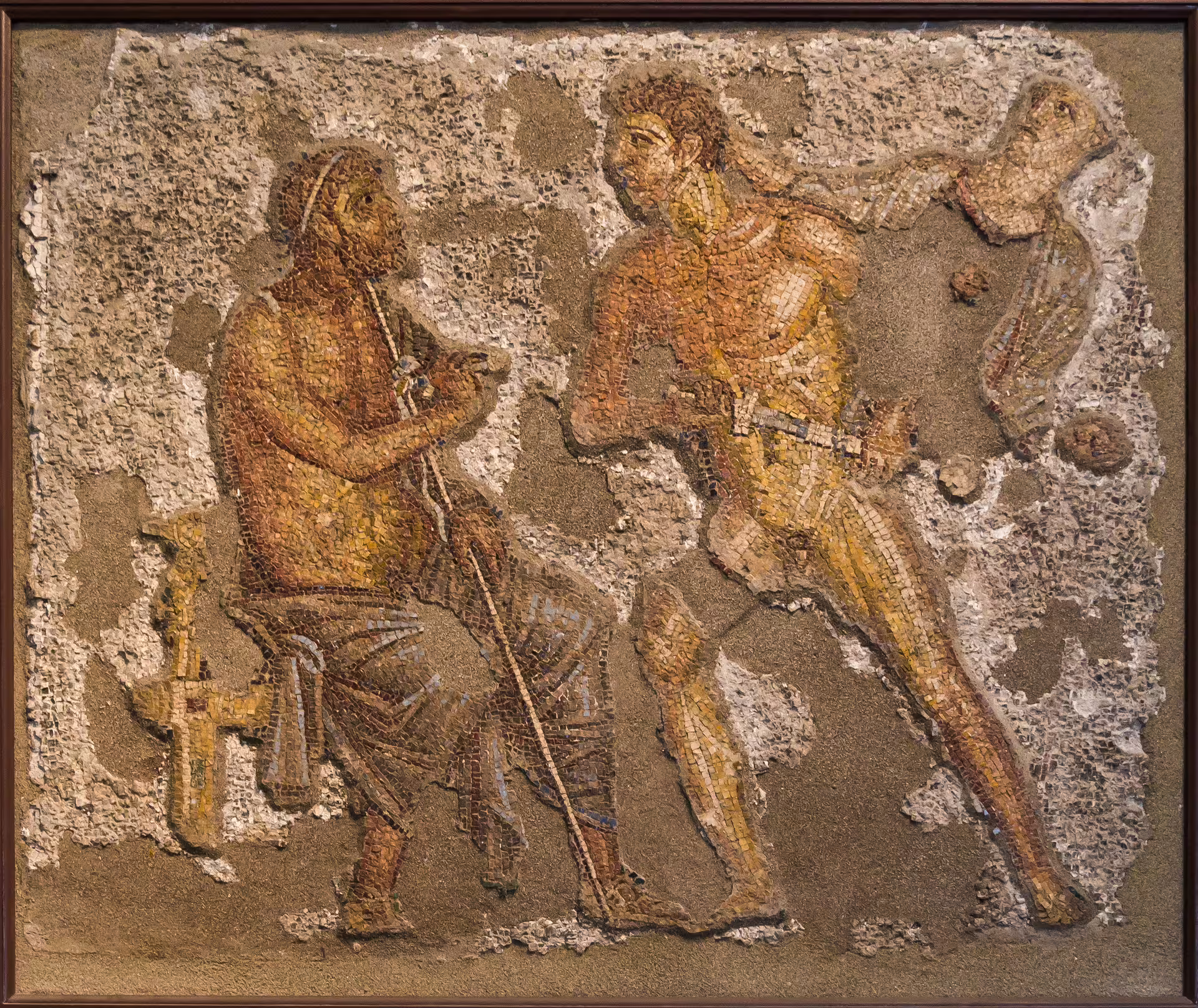 Ancient Roman mosaic of two figures in motion at Pompeii, highlighting archaeology on Italy of the Emperors tour