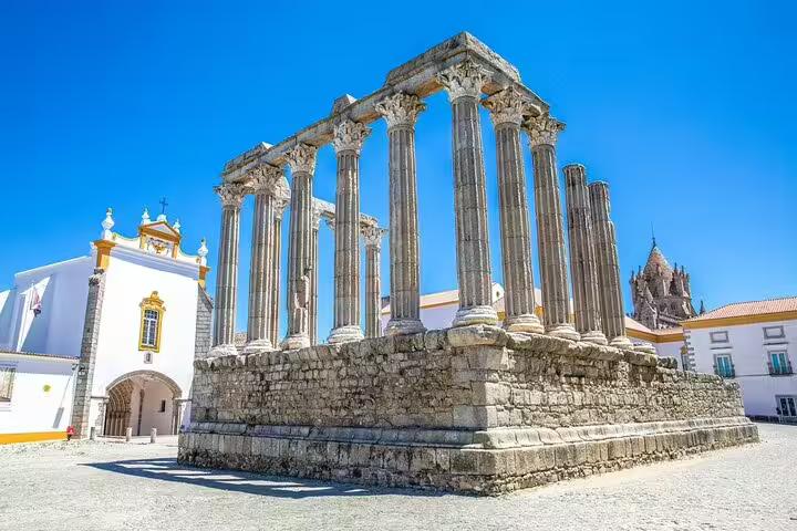 Roman Temple of Évora under blue sky, highlight stop on Faro to Lisbon private transfer with 2-hour tour