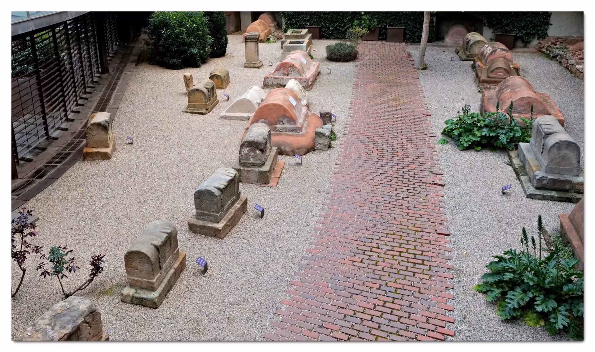 Historic Roman tombstones in Barcelona's Gothic Quarter, part of the 'Misterios y leyendas de Barcelona' tour.