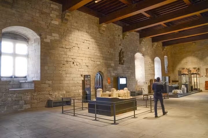 Explore the historic stone interiors of a Romanesque church on the Churches of Provence & French Countryside Tour.