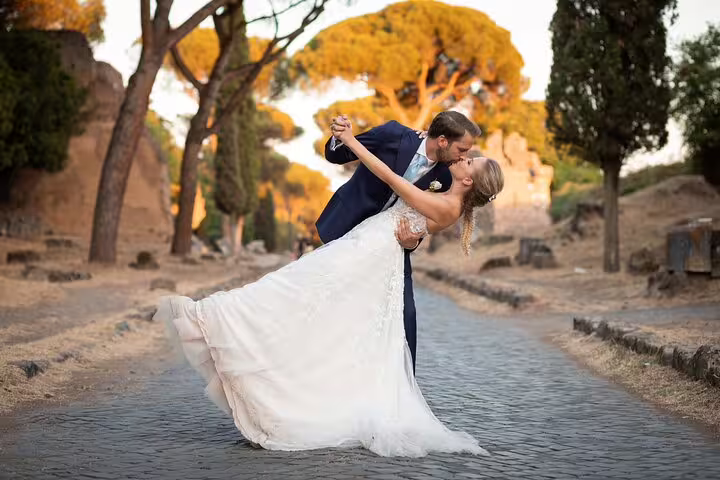 Romantic couple dip kiss in wedding attire, ideal for Venice destination wedding photography session in Italy