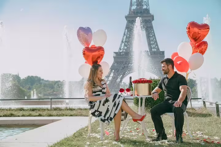 Romantic Eiffel Tower picnic with heart balloons, photographed on a private Paris personal travel photographer tour