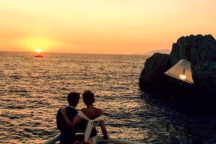 Couple enjoying a romantic sunset view on a 40-feet boat cruise from Sorrento, perfect for intimate getaways.