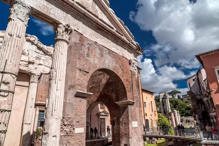 Ancient Roman ruins under a vibrant sky, showcasing the architectural marvels explored on the Private Walking Tour of Rome's secrets.
