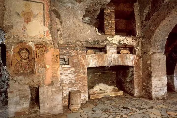 Ancient Christian frescoes and tombs inside Rome’s catacombs, visited on Colosseum and underground tours with guided transfer