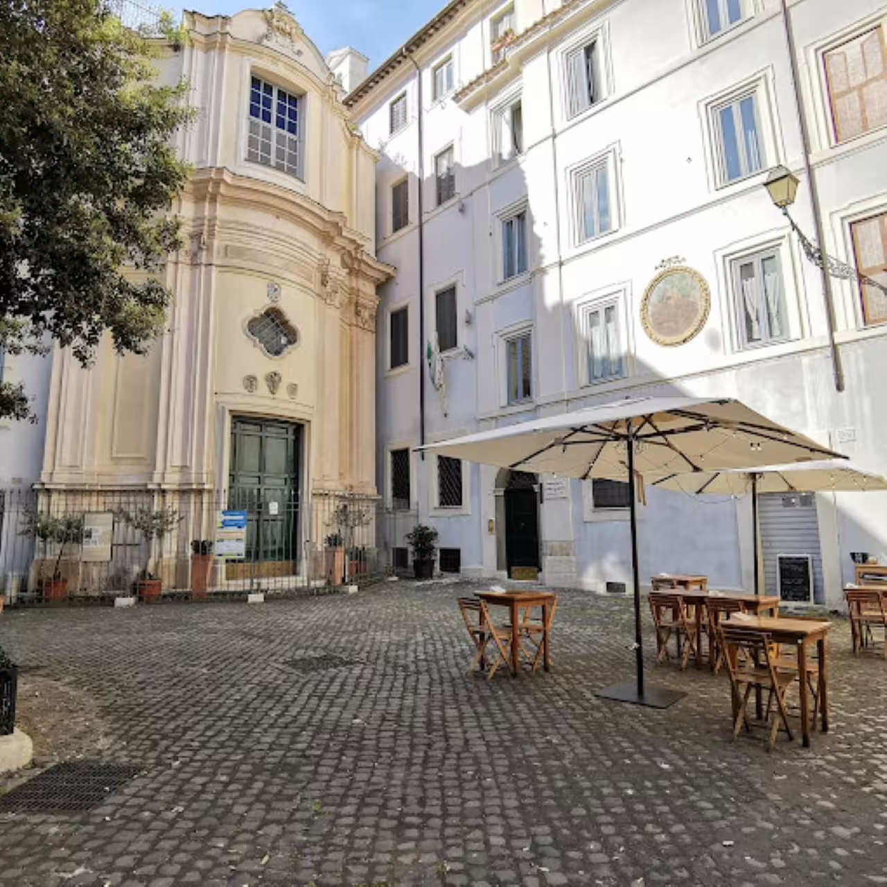 Charming Rome city center piazza with outdoor tables, ideal start for an exclusive wine tasting tour