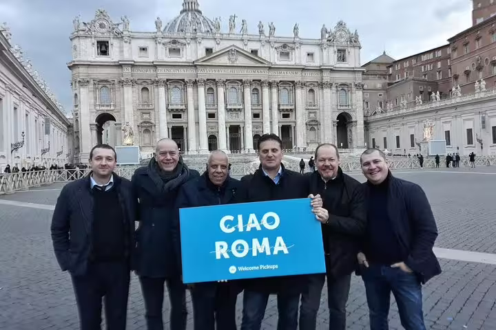 Group photo in St. Peter’s Square with Ciao Roma sign, private half-day Rome sightseeing tour with guide
