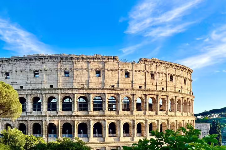 Panoramic exterior of the Rome Colosseum on a sunny day, featured on an exclusive Ancient Rome private guided tour