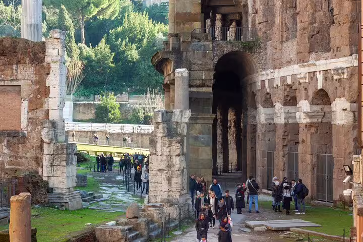 Visitors explore the ancient ruins of the Rome Colosseum, a key highlight on the Rome Colosseum, Forum, Pantheon tour.