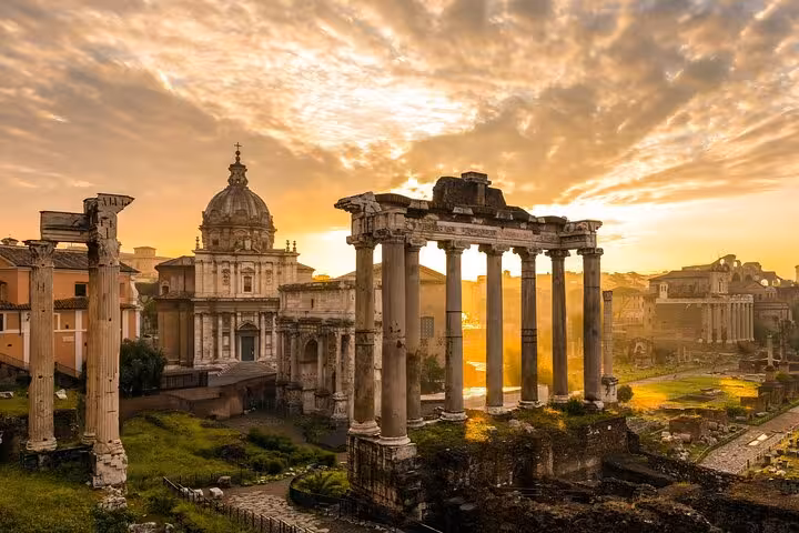 Sunrise over the Roman Forum and Palatine Hill ruins, capturing the timeless beauty of Rome's historical heart.