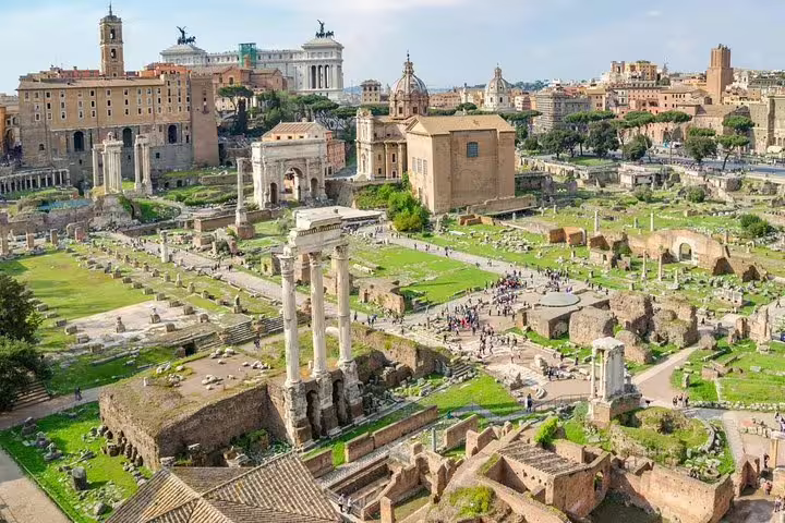 Panoramic view of the Roman Forum ruins and city skyline included in a Rome Colosseum and Ancient Rome private guided tour