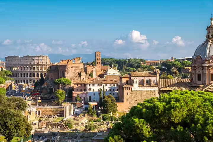 Scenic skyline of ancient Rome with the Colosseum, Roman Forum ruins and historic churches included in combined tour tickets