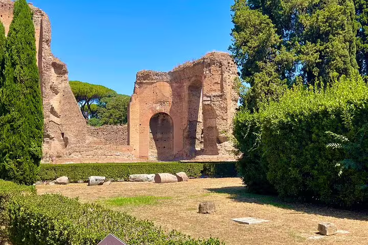 Wide view of Roman ruins and gardens by the Colosseum, visited on Rome Colosseum and catacombs underground tour tickets