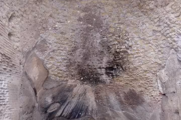 Discover the intricate stonework of Rome's underground chambers, part of the exclusive Colosseum Arena tour.