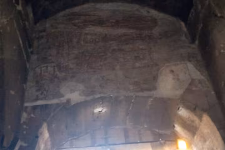 Faded wall fresco in the underground section of Rome's Colosseum, part of the exclusive underground tour.