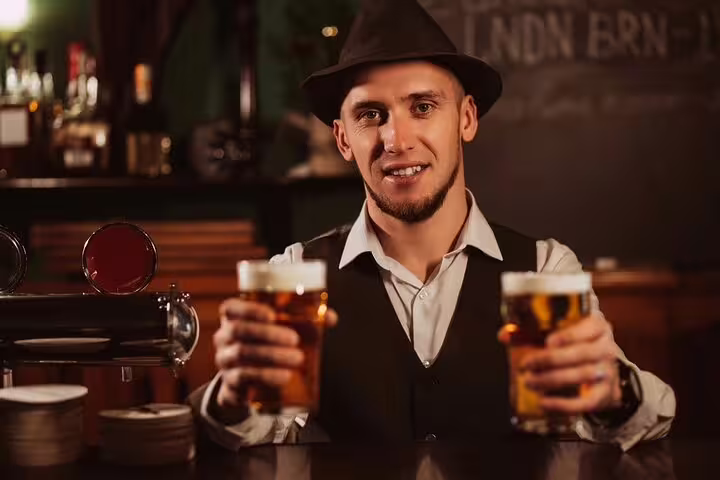 A friendly bartender offers two craft beers during the Vatican's Craft Beer Private Tour with a local foodie experience.