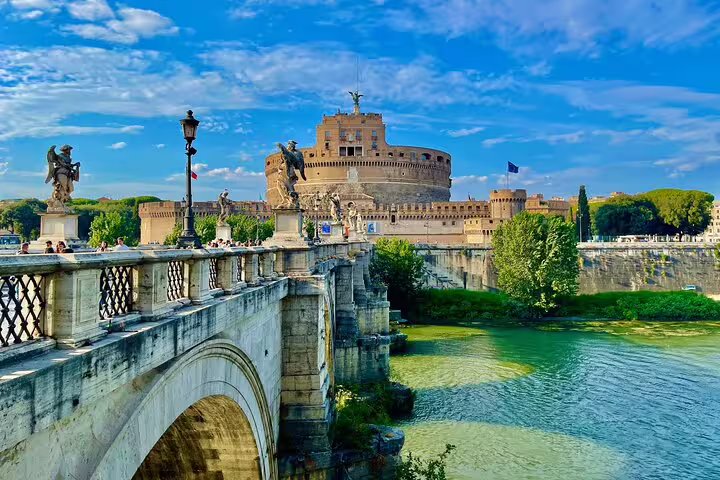 Castel Sant’Angelo and Ponte Sant’Angelo over the Tiber River on a Rome private double decker open bus panoramic tour