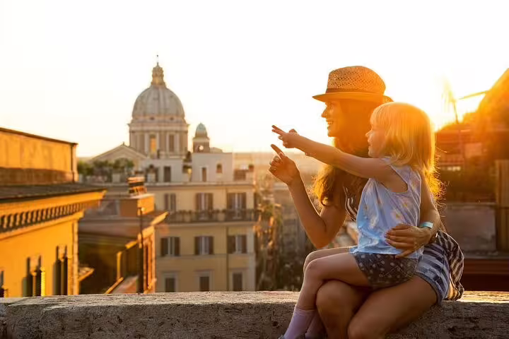 Mother and daughter enjoy sunset views over Rome’s domes on a family friendly private tour of hidden city treasures