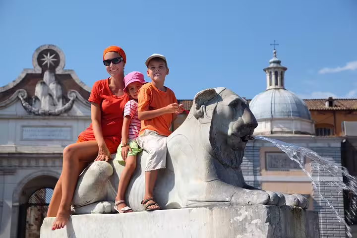 Family enjoys Rome's iconic Piazza del Popolo fountain during a fun-filled private tour with games and local delicacies for kids.