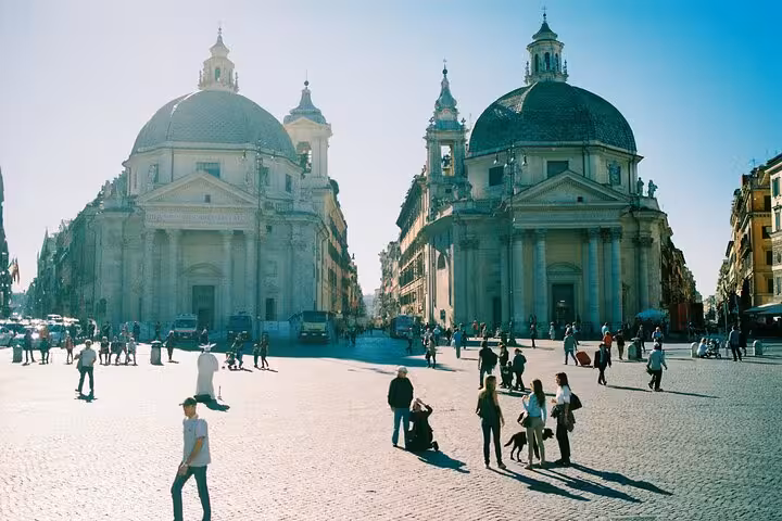 Visitors explore Rome's iconic Piazza del Popolo, perfect for a Golf Cart Tour with a local guide.