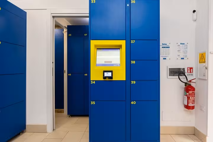 Efficient luggage storage in Rome featuring blue lockers with an automated system for secure and convenient access.